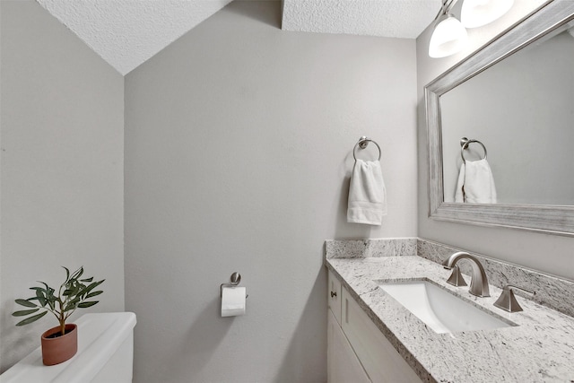 2120 El Paseo St Unit 501, Houston, TX 77054 - bathroom featuring a textured ceiling and vanity