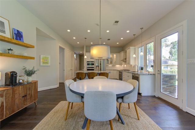 1121 Lashbrook Dr, Houston, TX 77077 - dining space featuring dark wood-style flooring and recessed lighting