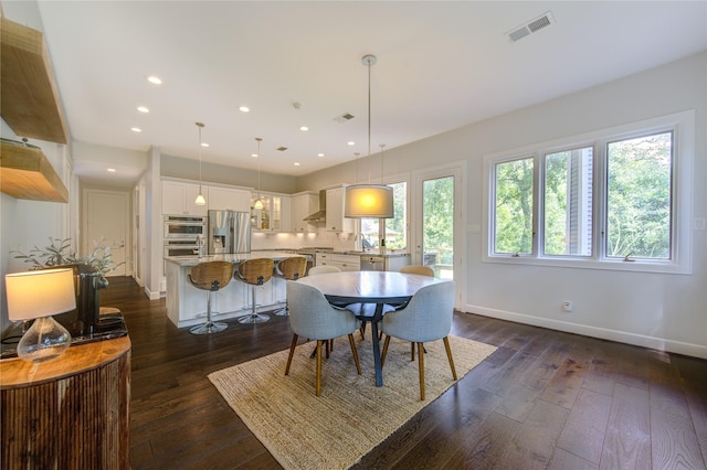 1121 Lashbrook Dr, Houston, TX 77077 - dining area with dark wood-style floors and recessed lighting