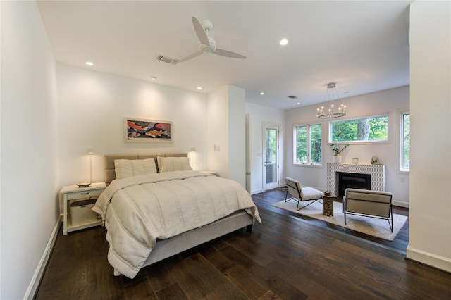1121 Lashbrook Dr, Houston, TX 77077 - bedroom featuring access to exterior, dark wood-type flooring, recessed lighting, a ceiling fan, and a chandelier