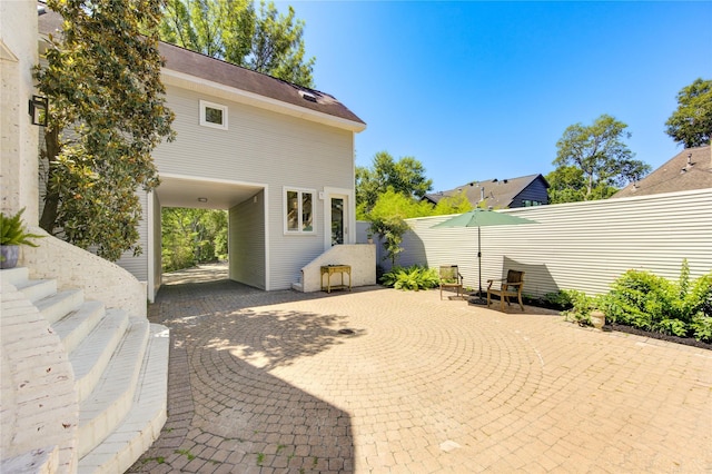 1121 Lashbrook Dr, Houston, TX 77077 - view of patio / terrace featuring a carport