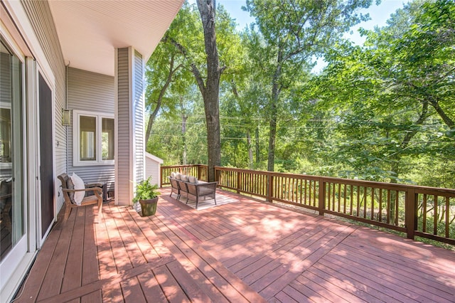 1121 Lashbrook Dr, Houston, TX 77077 - wooden deck with an outdoor hangout area and view of scattered trees