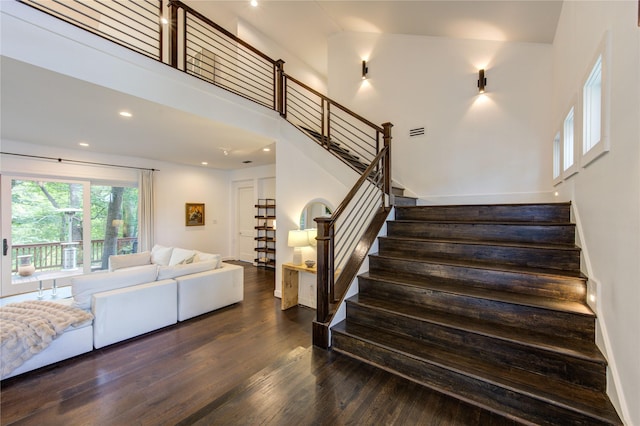 1121 Lashbrook Dr, Houston, TX 77077 - stairway featuring wood finished floors, recessed lighting, and a high ceiling