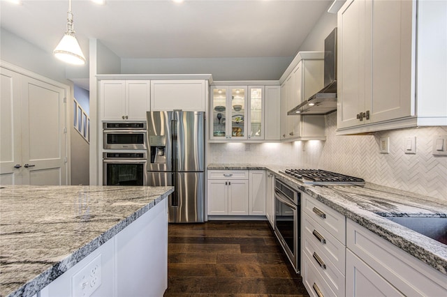 1121 Lashbrook Dr, Houston, TX 77077 - kitchen with appliances with stainless steel finishes, wall chimney exhaust hood, dark wood-style flooring, and white cabinets