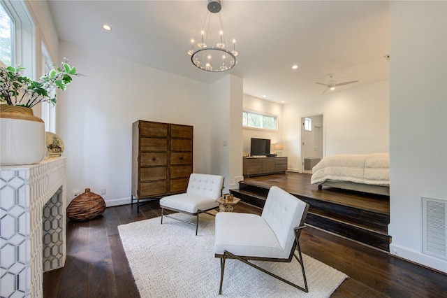 1121 Lashbrook Dr, Houston, TX 77077 - bedroom featuring hardwood / wood-style flooring, a fireplace, recessed lighting, and a chandelier