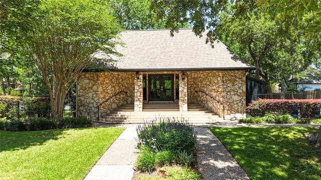 1121 Lashbrook Dr, Houston, TX 77077 - view of front of property with stone siding, french doors, and roof with shingles