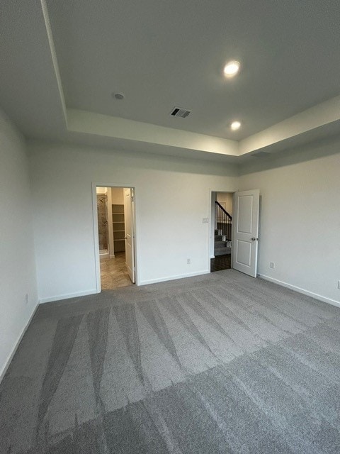 1127 Buffalo Run, Tomball, TX 77375 - unfurnished room featuring a raised ceiling, carpet, stairs, and recessed lighting