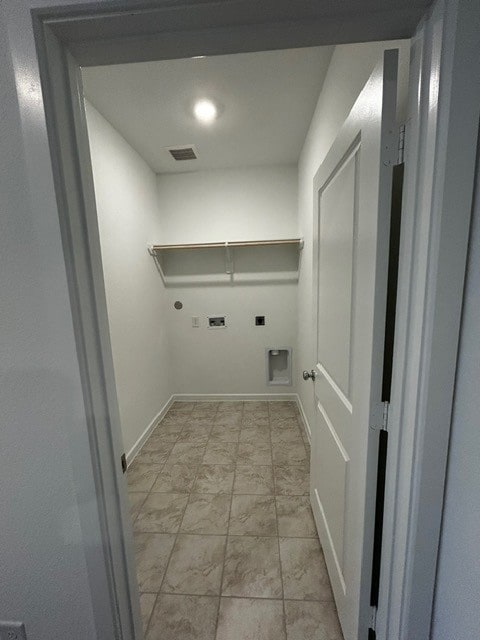 1127 Buffalo Run, Tomball, TX 77375 - washroom with electric dryer hookup and hookup for a gas dryer