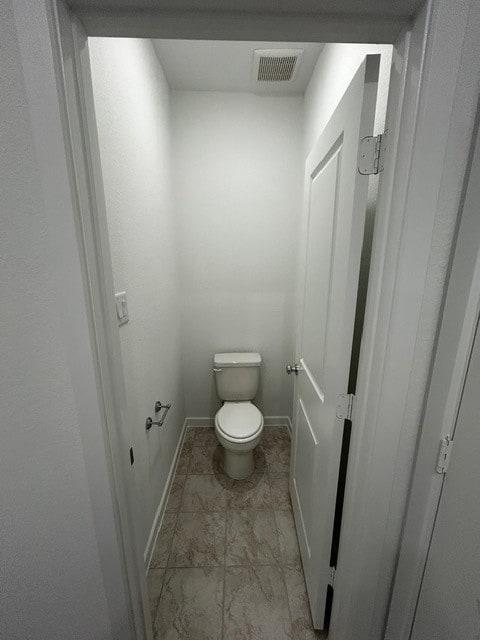 1127 Buffalo Run, Tomball, TX 77375 - bathroom with toilet and baseboards