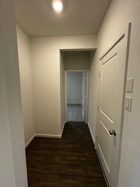 1127 Buffalo Run, Tomball, TX 77375 - corridor with dark wood-style flooring and baseboards