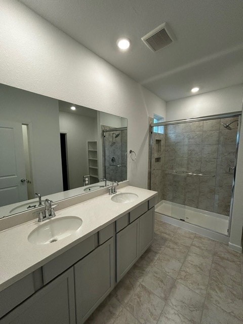 1127 Buffalo Run, Tomball, TX 77375 - full bathroom with a stall shower, double vanity, and recessed lighting