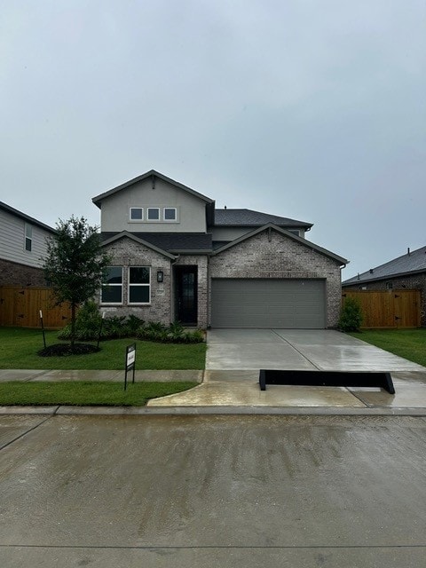 1127 Buffalo Run, Tomball, TX 77375 - traditional-style house featuring an attached garage, concrete driveway, and brick siding