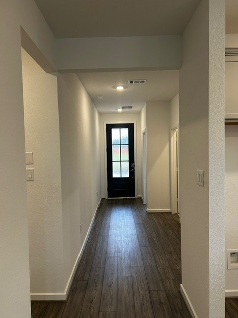 1127 Buffalo Run, Tomball, TX 77375 - corridor with dark wood-style flooring and baseboards