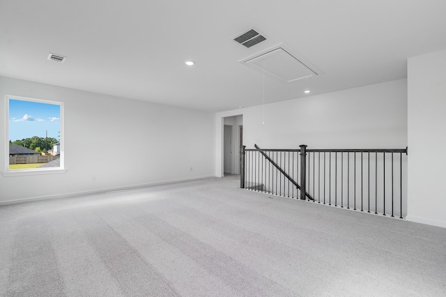 1127 Buffalo Run, Tomball, TX 77375 - carpeted spare room with attic access and recessed lighting