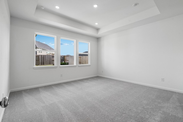 1127 Buffalo Run, Tomball, TX 77375 - unfurnished room featuring a raised ceiling, carpet flooring, recessed lighting, and a smoke detector