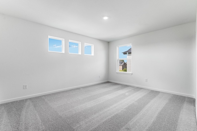 1127 Buffalo Run, Tomball, TX 77375 - carpeted spare room with baseboards and recessed lighting