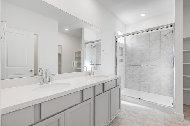 1127 Buffalo Run, Tomball, TX 77375 - bathroom with a stall shower, double vanity, a spacious closet, and recessed lighting