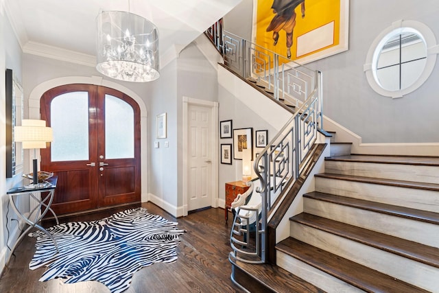 38 Hackberry Ln, Houston, TX 77027 - entrance foyer with arched walkways, healthy amount of natural light, wood finished floors, a chandelier, and ornamental molding