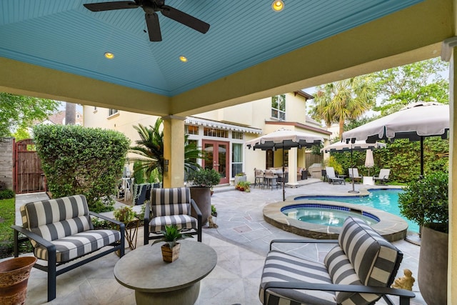 38 Hackberry Ln, Houston, TX 77027 - view of patio / terrace with french doors, an in-ground hot tub, ceiling fan, and a gate