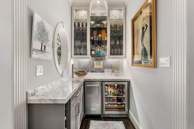 38 Hackberry Ln, Houston, TX 77027 - indoor dry bar featuring beverage cooler, ornamental molding, and tasteful backsplash