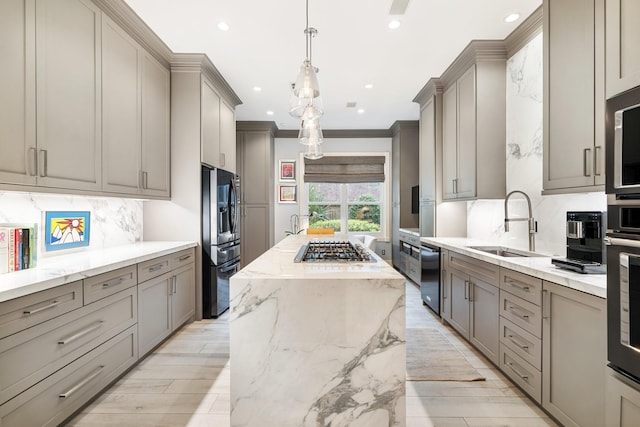 38 Hackberry Ln, Houston, TX 77027 - kitchen featuring gray cabinetry, stainless steel appliances, tasteful backsplash, recessed lighting, and a kitchen island