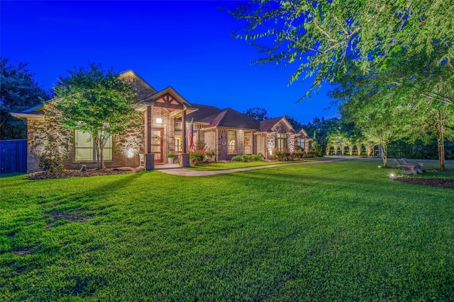 17817 Ranch House Rd, College Station, TX 77845 - view of front facade with a front yard and stone siding