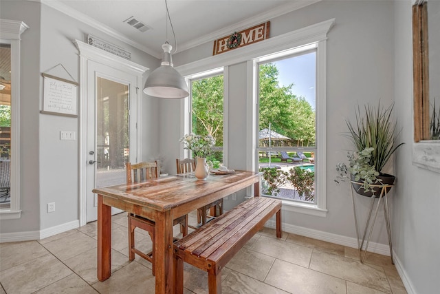 17817 Ranch House Rd, College Station, TX 77845 - dining area with crown molding and light tile patterned floors