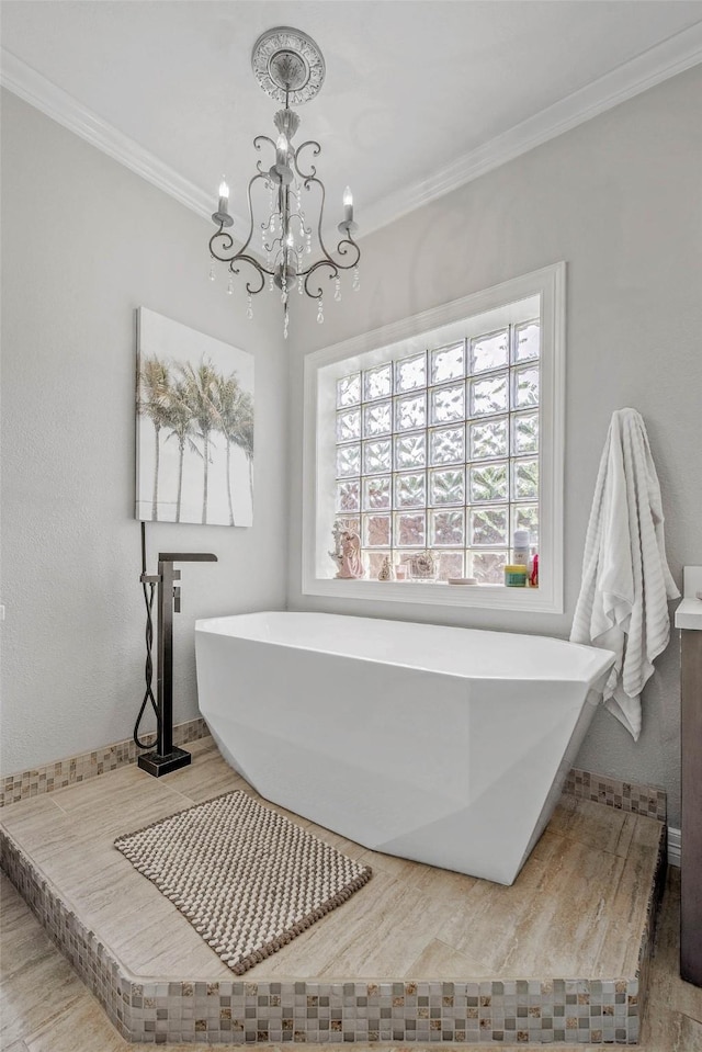 17817 Ranch House Rd, College Station, TX 77845 - bathroom with a chandelier, a freestanding tub, and ornamental molding