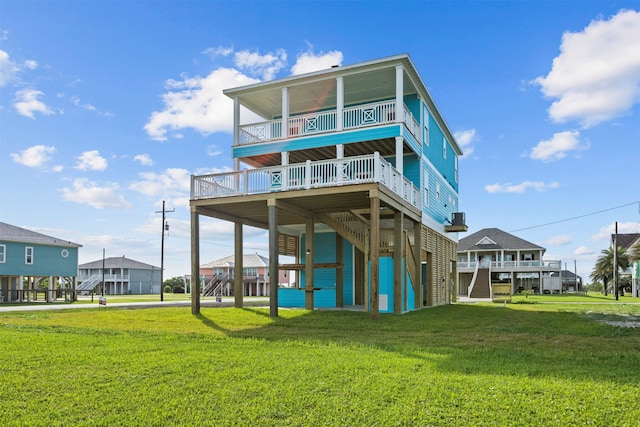 210 Galveston St, Crystal Beach, TX 77650 - back of property with a lawn and a deck