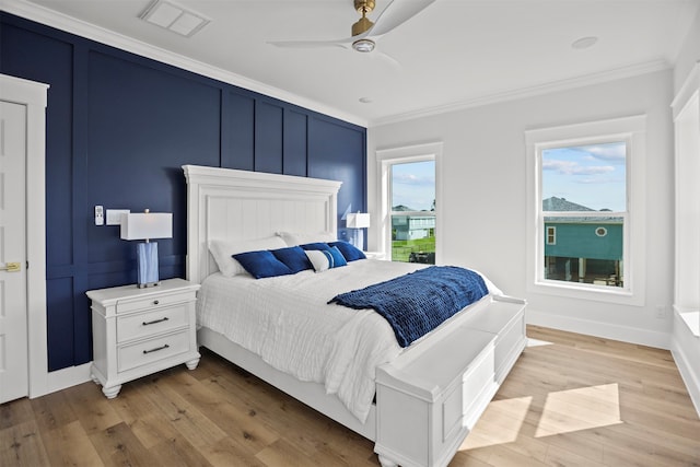 210 Galveston St, Crystal Beach, TX 77650 - bedroom with ornamental molding, light wood-style floors, and a ceiling fan