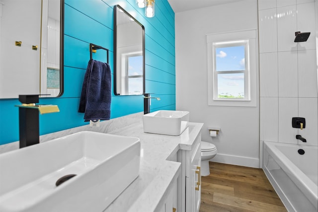 210 Galveston St, Crystal Beach, TX 77650 - bathroom with double vanity, wood finished floors, and shower / bath combination