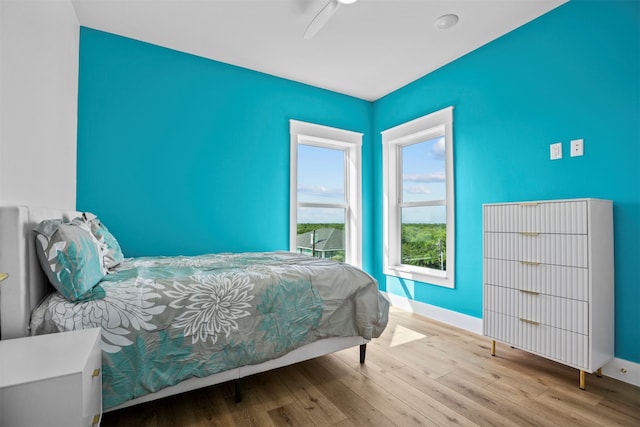 210 Galveston St, Crystal Beach, TX 77650 - bedroom featuring wood finished floors and a ceiling fan