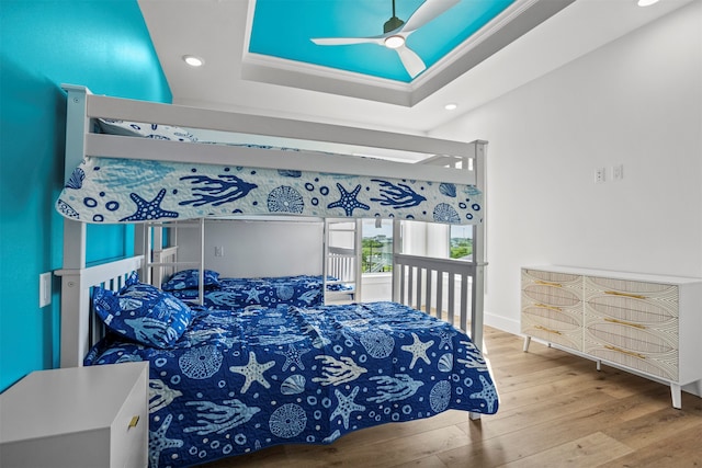 210 Galveston St, Crystal Beach, TX 77650 - bedroom with recessed lighting, wood finished floors, ceiling fan, and a raised ceiling