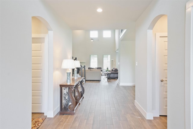 21018 Cypress Creek View Ct, Humble, TX 77338 - hallway featuring wood finished floors, recessed lighting, and arched walkways