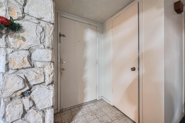 12339 W Village Dr Unit D, Houston, TX 77039 - entrance foyer with a textured ceiling and light floors