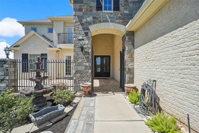 5924 Oak Leaf Ct, Conroe, TX 77304 - property entrance with french doors, brick siding, and stone siding