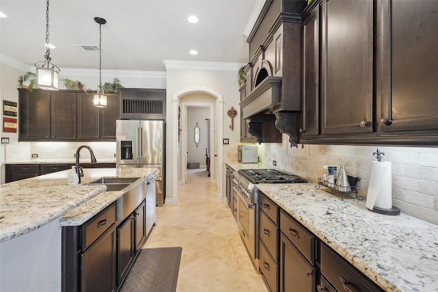 5924 Oak Leaf Ct, Conroe, TX 77304 - kitchen featuring ornamental molding, dark brown cabinetry, tasteful backsplash, high quality appliances, and light stone counters