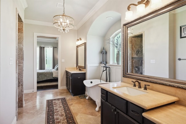 5924 Oak Leaf Ct, Conroe, TX 77304 - ensuite bathroom with plenty of natural light, two vanities, ornamental molding, a chandelier, and a freestanding bath