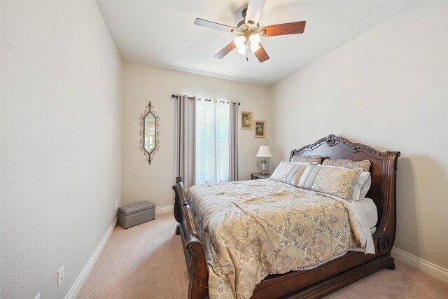 5924 Oak Leaf Ct, Conroe, TX 77304 - bedroom with light colored carpet and a ceiling fan