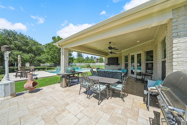 5924 Oak Leaf Ct, Conroe, TX 77304 - view of patio with outdoor dining area, a grill, a ceiling fan, and french doors