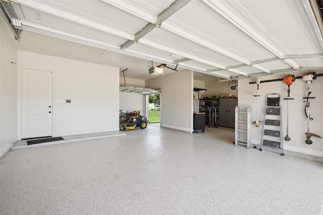 5924 Oak Leaf Ct, Conroe, TX 77304 - garage with a garage door opener and baseboards