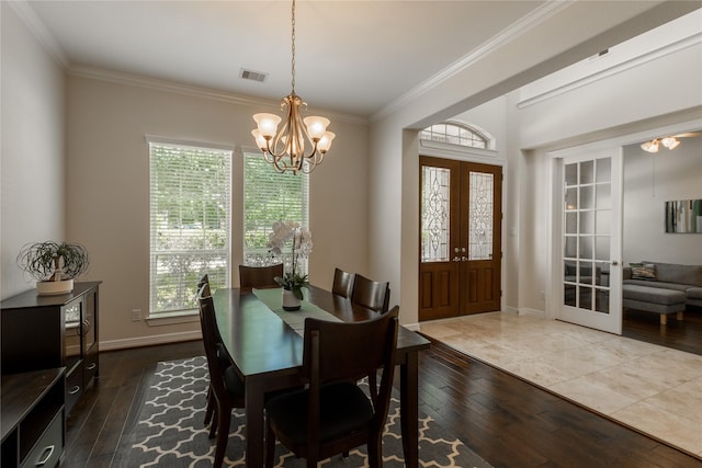 28423 Tanner Crossing Ln, Katy, TX 77494 - dining space featuring hardwood / wood-style flooring, french doors, ornamental molding, and a chandelier