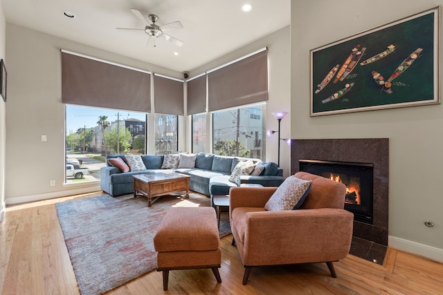 5122 Lillian St, Houston, TX 77007 - living area with a fireplace with flush hearth, a ceiling fan, wood finished floors, and recessed lighting