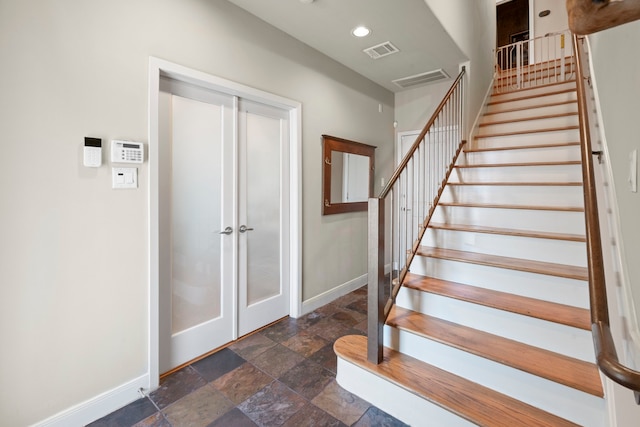 5122 Lillian St, Houston, TX 77007 - stairway with stone finish flooring, french doors, and recessed lighting