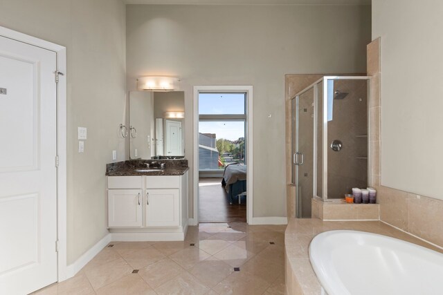 5122 Lillian St, Houston, TX 77007 - bathroom with a shower stall, a garden tub, vanity, and tile patterned floors