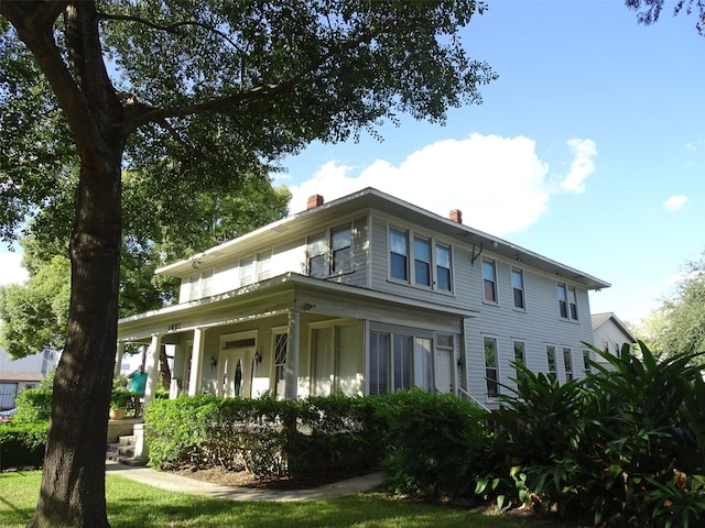 1401 Truxillo St, Houston, TX 77004 - rear view of property with a chimney and covered porch