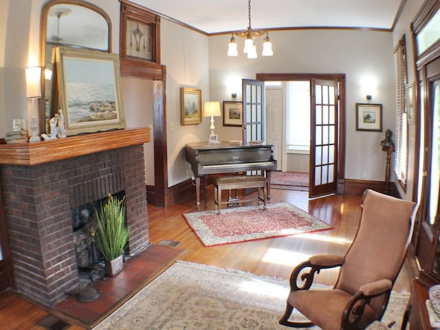 1401 Truxillo St, Houston, TX 77004 - sitting room with plenty of natural light, wood finished floors, a fireplace, and crown molding