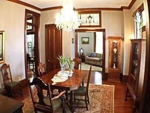 1401 Truxillo St, Houston, TX 77004 - dining area featuring ornamental molding, a chandelier, and wood finished floors