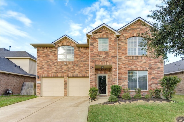24514 Hikers Bend Dr, Katy, TX 77493 - traditional home featuring driveway, an attached garage, a front lawn, and brick siding