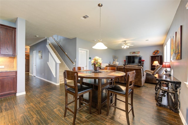 24514 Hikers Bend Dr, Katy, TX 77493 - dining space featuring stairway, ceiling fan, and dark wood-type flooring
